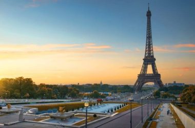 Eiffel Tower and fountains near it at dawn in Paris, France
